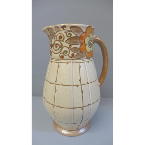 604 - A Charlotte Rhead Bursley Ware trellis pattern jug, 24.5cm