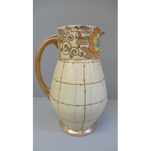 604 - A Charlotte Rhead Bursley Ware trellis pattern jug, 24.5cm