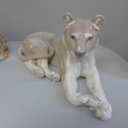 607 - Two USSR made model giraffe and a Royal Copenhagen lioness