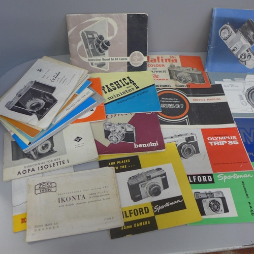 617 - A box of vintage camera booklets and a pocket viewer