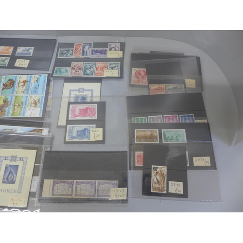 619 - Stamps; small collection of better individual stamps and sets on stock cards with a catalogue value ... 