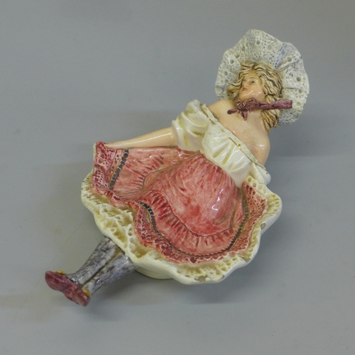 633 - An early 20th Century ‘cheeky’ trinket dish, length 20cm, some small chips