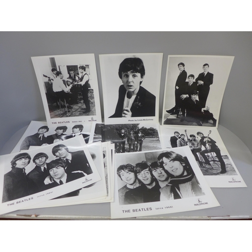 641 - A collection of thirteen original Beatles EMI promotional photographs