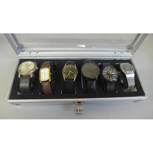 680 - Six wristwatches in a case, including Swatch and Timex