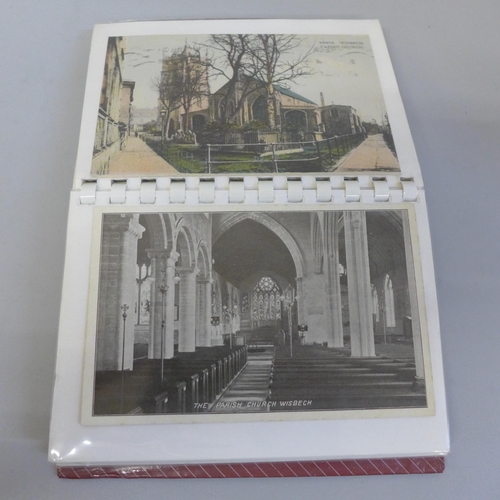 685 - Postcards; two postcard albums of Wisbech and March including some RPP's of pig roasts, etc.