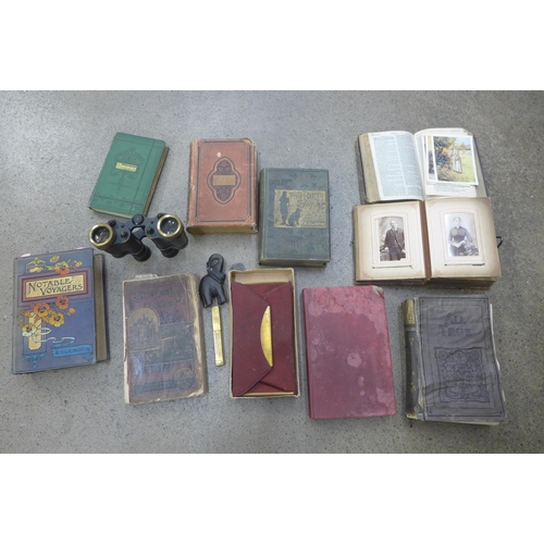 711 - A collection of books, a pair of military binoculars marked Kershaw 1943, a lighter, etc.