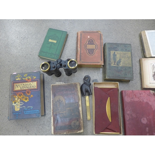 711 - A collection of books, a pair of military binoculars marked Kershaw 1943, a lighter, etc.