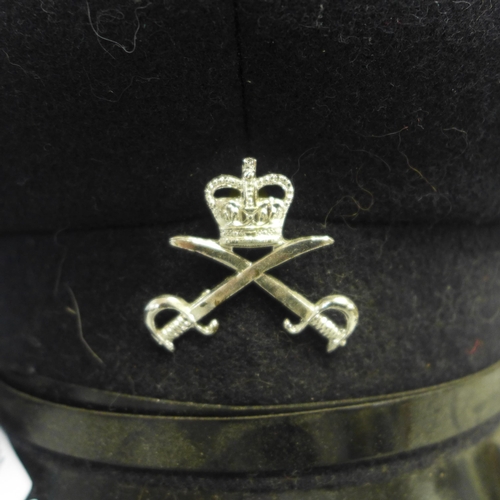 744 - A RAF peaked cap, one other and a mortar board