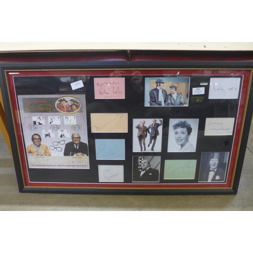 761 - An autographed comedy display; Eric Morecambe, Ernie Wise, Ronnie Barker, Ronnie Corbett, Peter Cook... 