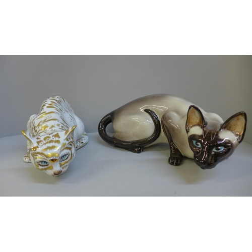 775 - A Studio pottery cat figure and a Capodimonte cat figure