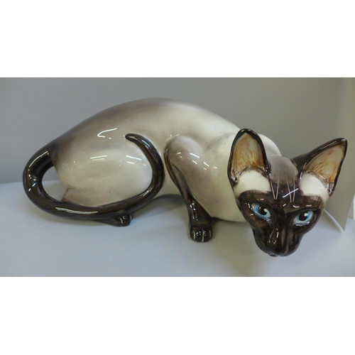 775 - A Studio pottery cat figure and a Capodimonte cat figure