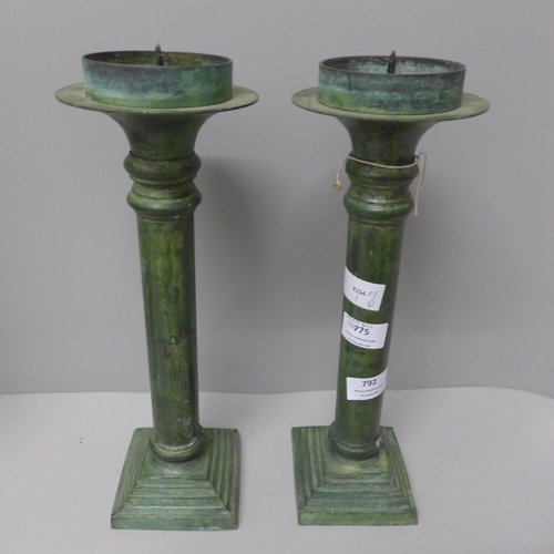 792 - A pair of verdigris brass candlesticks, 35cm