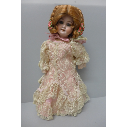 804 - A German made doll, marked 18 94, AM DEP, 41cm