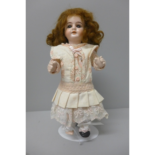 805 - A doll, marked 1902, 12/0, 27cm