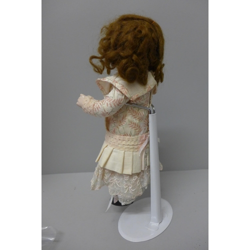 805 - A doll, marked 1902, 12/0, 27cm