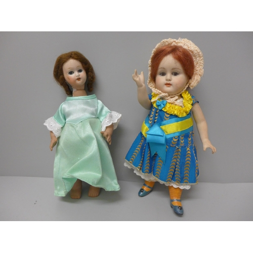 809 - A German doll with green dress, head cracked, 22cm, and one other doll