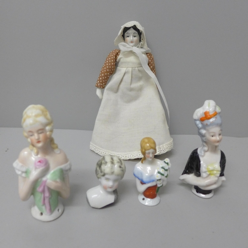 811 - Three half doll pin cushion dolls, a small doll and a doll's head