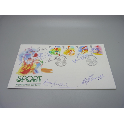 818 - A 1988 Royal Mail First Day Cover with six World Cup 1966 winners autographs, Alf Ramsey, Bobby Moor... 