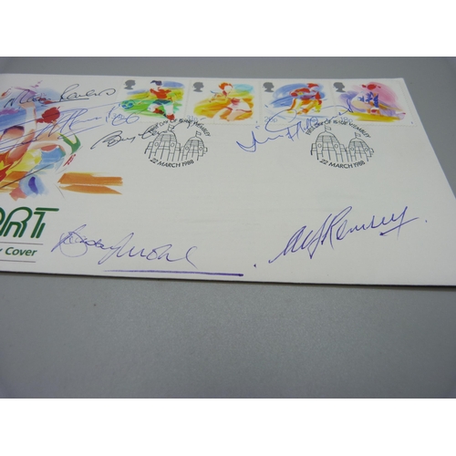 818 - A 1988 Royal Mail First Day Cover with six World Cup 1966 winners autographs, Alf Ramsey, Bobby Moor... 