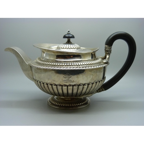 827 - A George III silver teapot, London 1812, maker W.B, 911g, the base with mid 20th Century inscription