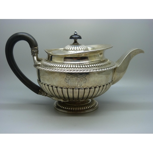 827 - A George III silver teapot, London 1812, maker W.B, 911g, the base with mid 20th Century inscription