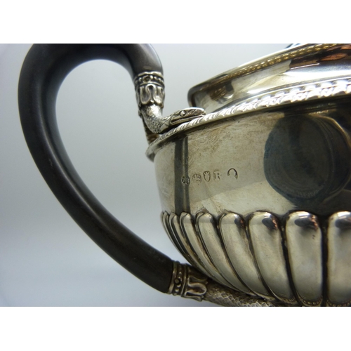 827 - A George III silver teapot, London 1812, maker W.B, 911g, the base with mid 20th Century inscription