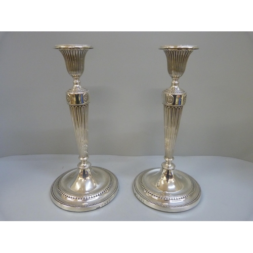 828 - A pair of George III silver candlesticks, Sheffield 1785, John Parsons & Co., 28cm