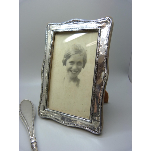 829 - A silver photograph frame, a/f, silver mounted bottles, glove stretchers, etc.