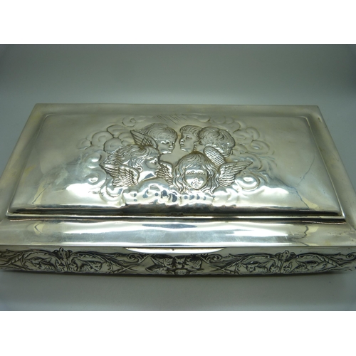 831 - A large silver jewellery box, decorated with Reynold's angels, Birmingham 1904, lid 28.5cm wide