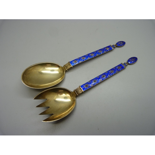 845 - A pair of silver gilt and enamel servers, Norway, J. Tostrup, 89g, 18cm