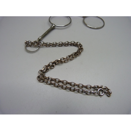 847 - A pair of lorgnettes on a silver chain