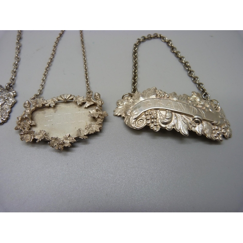 849 - A pair of hallmarked silver wine labels, one other hallmarked silver label, Port, and a Brandy label... 