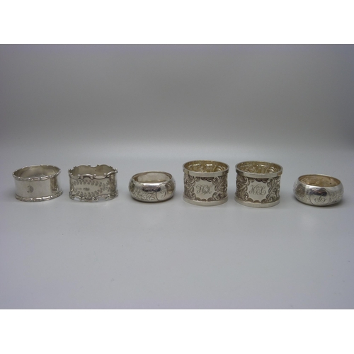 850 - Six silver napkin rings, two pairs and two singles, 118g