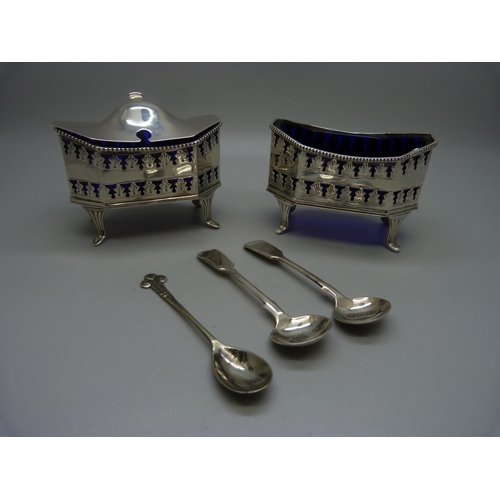 854 - A large hallmarked silver mustard, London 1913, 98g, and a matching plated salt, with blue glass lin... 