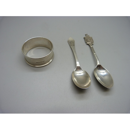 864 - Two silver spoons and a silver napkin ring, 40g