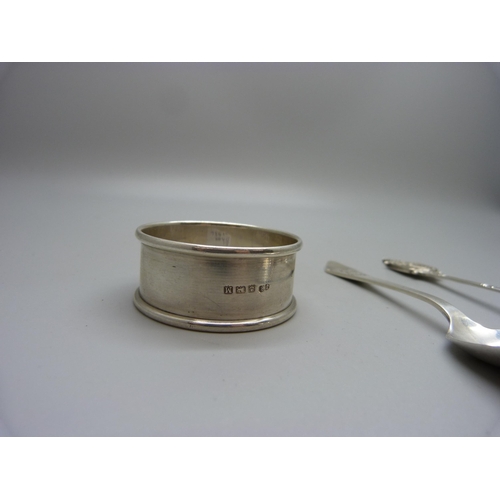 864 - Two silver spoons and a silver napkin ring, 40g