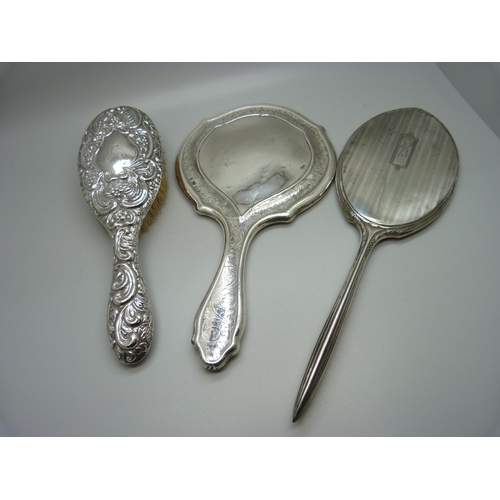 871 - Two silver mirrors and a brush