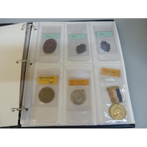 880 - A folder of medallions and badges including Leicester Royal Infirmary 1926 Training School, school m... 