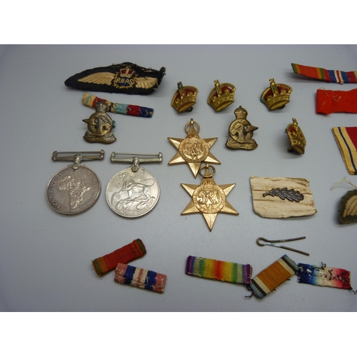 901 - Four WWII medals including Africa Service Medal to 222726 G.A. Munro and assorted ribbons, badges, a... 