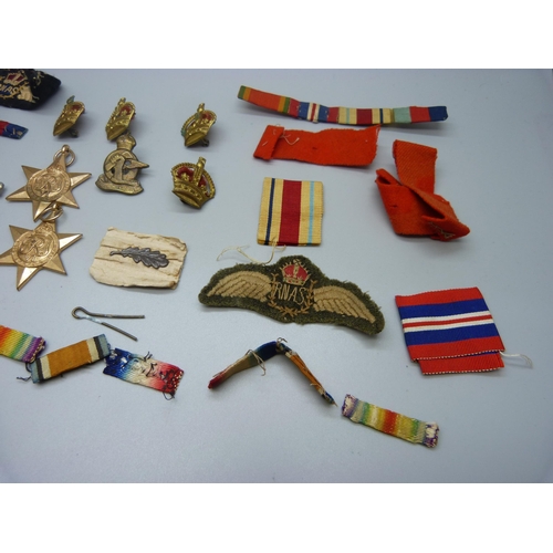 901 - Four WWII medals including Africa Service Medal to 222726 G.A. Munro and assorted ribbons, badges, a... 