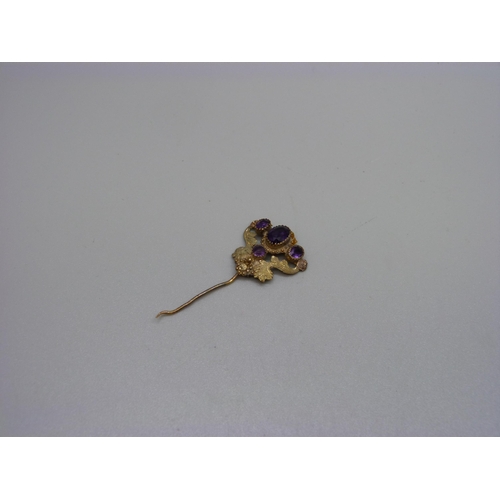 922 - A Victorian yellow metal and amethyst hinged pin (part pin lacking), 1.9g