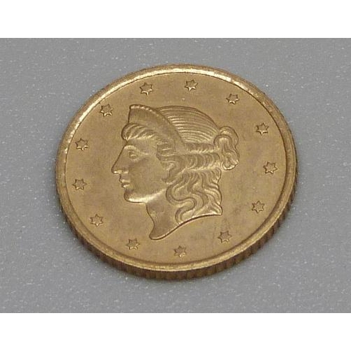 929 - An 1853 USA 1 Taler gold coin, 1.5g