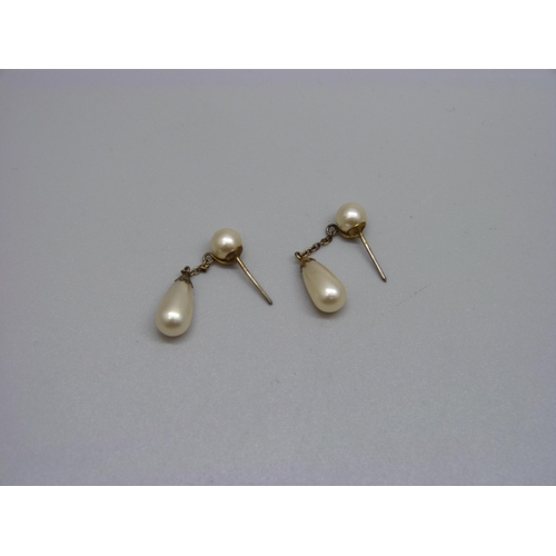 932 - A pair of pearl drop earrings