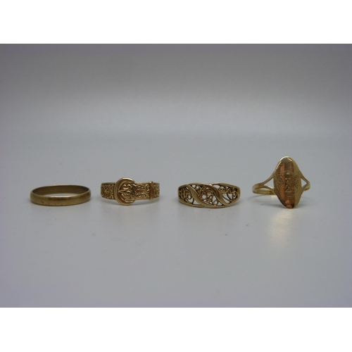 939 - Four 9ct gold rings including a buckle ring, 7.1g