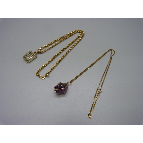 945 - A 9ct gold and green stone pendant on a 9ct gold chain, and an amethyst pendant on a 9ct gold chain,... 