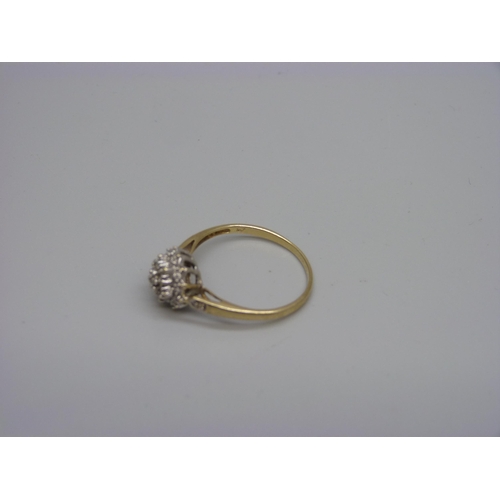 949 - A 9ct gold and diamond cluster ring, 2.5g, V