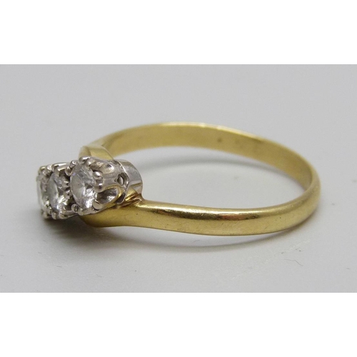 964 - An 18ct gold three stone diamond ring, 3.8g, R, 0.5ct diamond weight marked on the shank