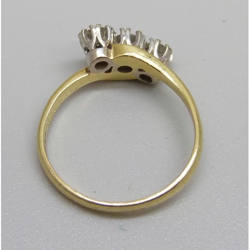 964 - An 18ct gold three stone diamond ring, 3.8g, R, 0.5ct diamond weight marked on the shank