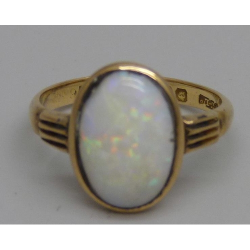 972 - An 18ct gold opal cabochon ring, Chester 1913, 3.4g, O