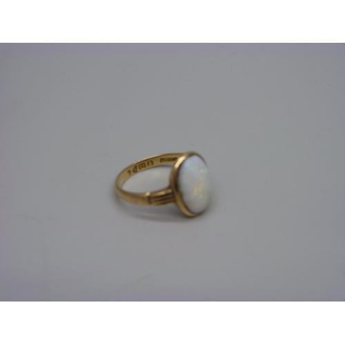 972 - An 18ct gold opal cabochon ring, Chester 1913, 3.4g, O